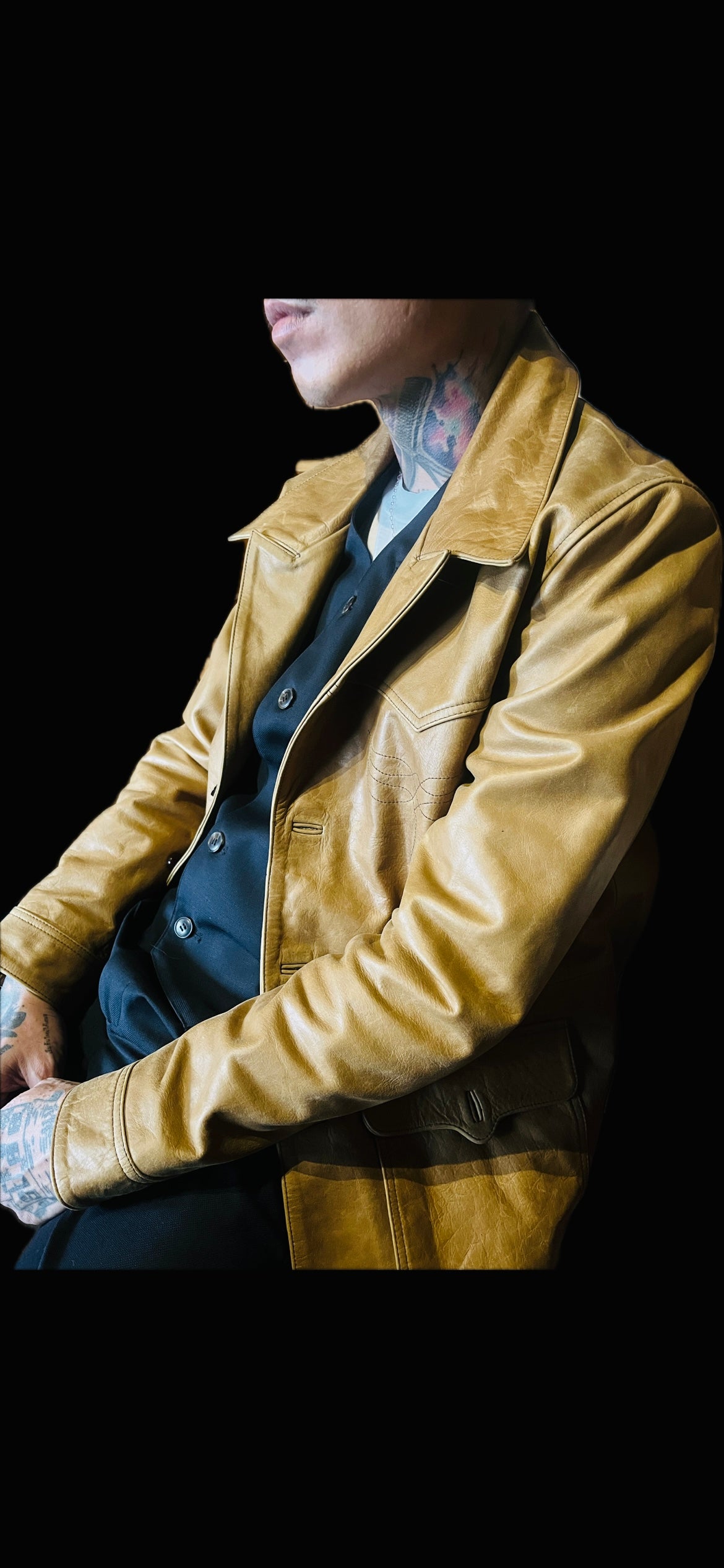 A man wearing a Suede tan jacket 