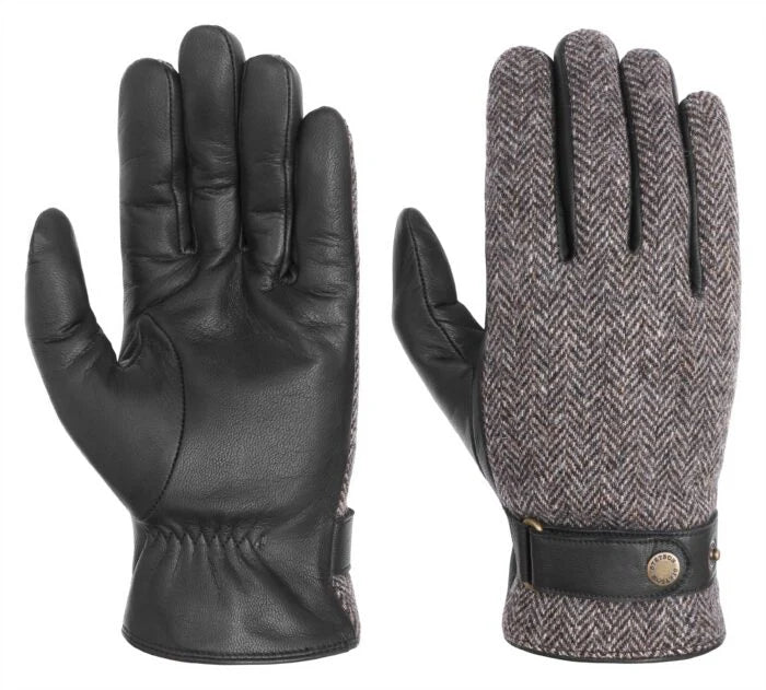 A pair of gloves with leather and herringbone fabric.