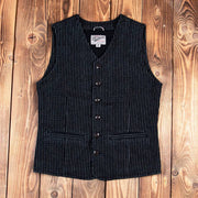 Pinstriped black vest with button-up front and two side pockets, styled against a wooden background, ideal for vintage or western-inspired outfits